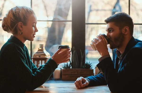 Romantic couple is sitting at cafe at their date — Stock Photo, Image