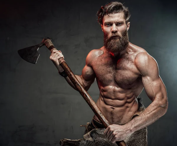 Nordic warrior with two handed axe in dark background — Stock Photo, Image