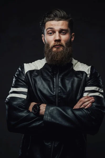 Handsome guy in jacket posing with crossed arms