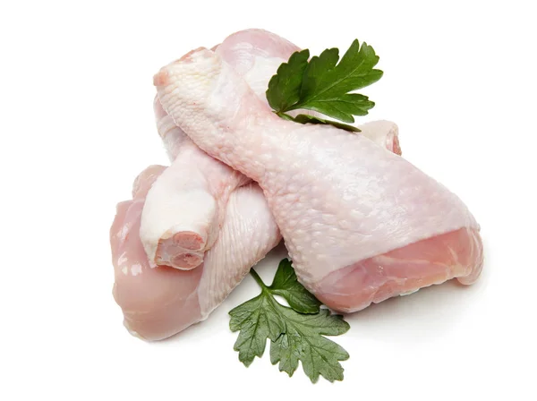 Gambe di pollo crude su sfondo bianco — Foto Stock