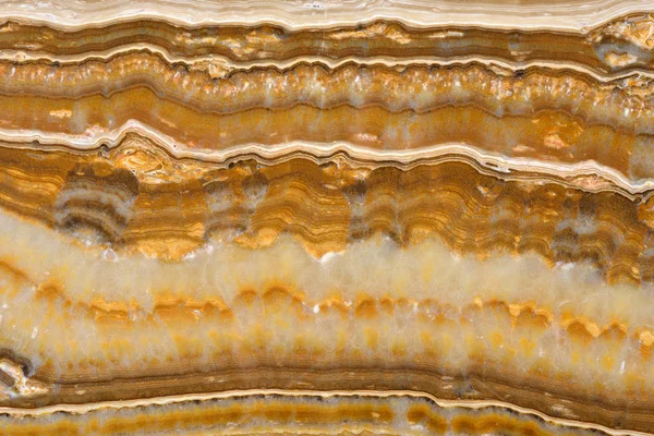 Verkliga naturliga ”Onyx Empire Gold” texturmönstret. Stockbild