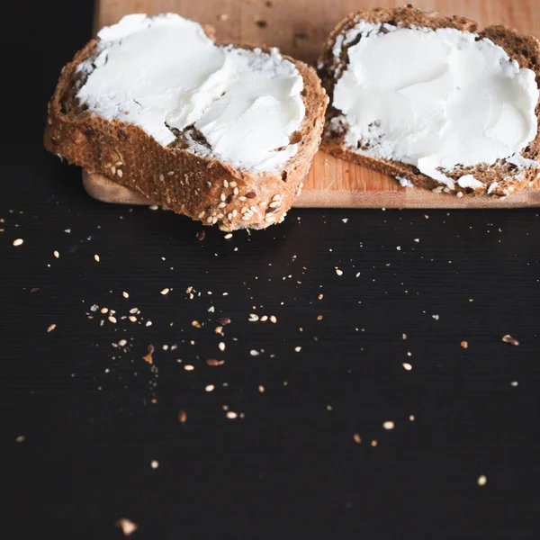 Two sandwiches of multi-grain bread with cream cheese — Stock Photo, Image