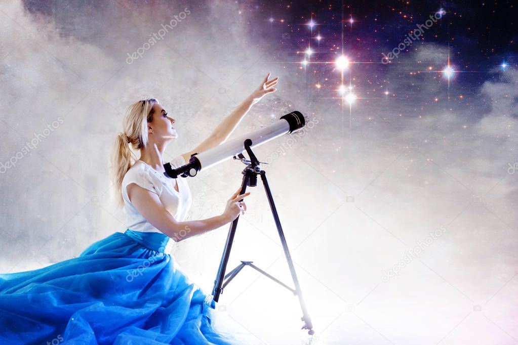 Young woman dreams of the future, concept. Girl looks up and uses a telescope. Starry sky behind the clouds