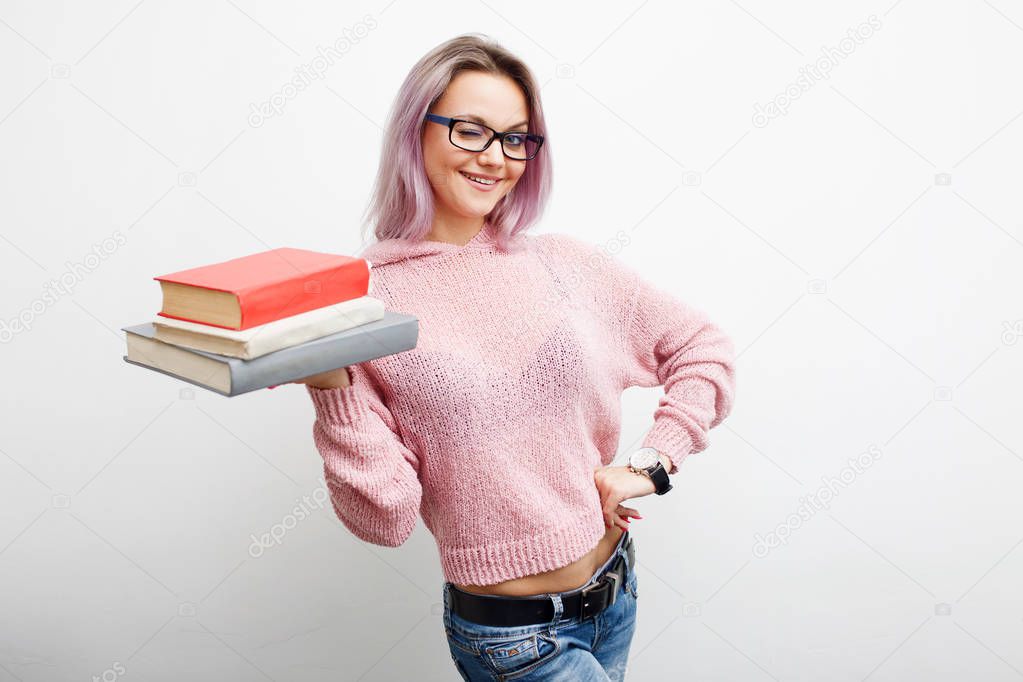 Student. Young woman with books.