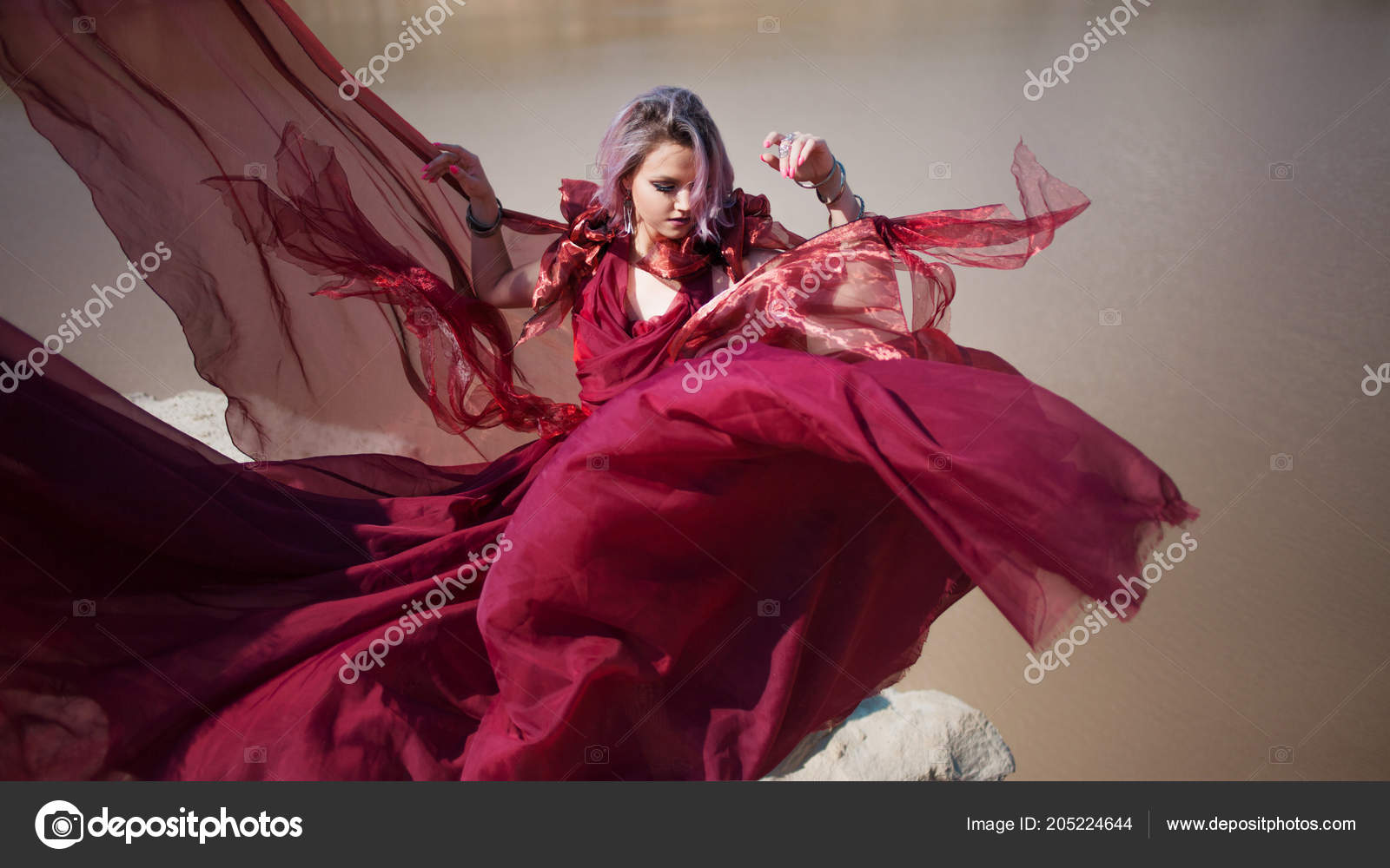 Lady in red. Young beautiful woman, delightful portrait in red flying