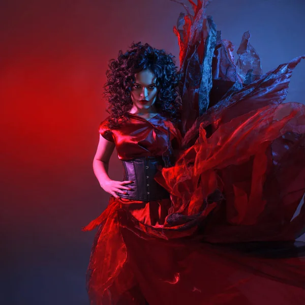 Gothic girl in red. Dancing young femme fatale — Stock Photo, Image