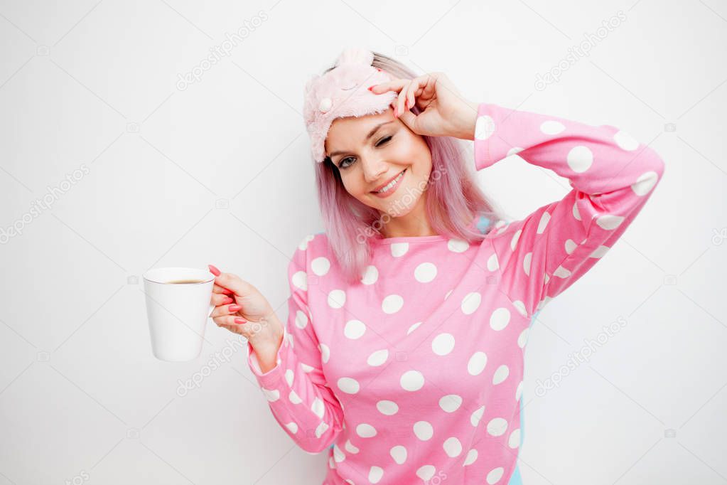 Morning motivation. Smiling young woman drinking morning coffee and happy.