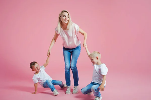 stock image Beautiful blonde mom with two happy sons. Young woman and two baby boys
