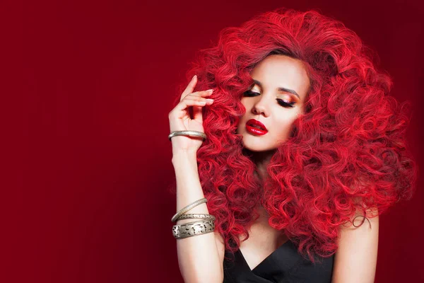 Young woman in total red style. Portrait of girl with curly red hair — Stock Photo, Image