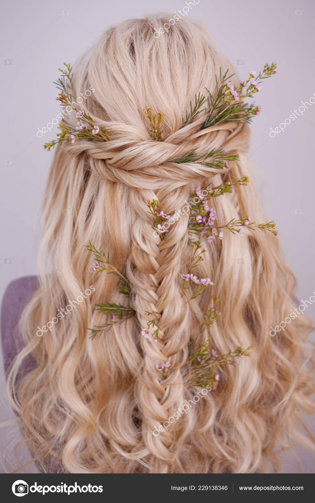 Back View Of An Elegant Trendy Hairstyle Interlacing Curls And