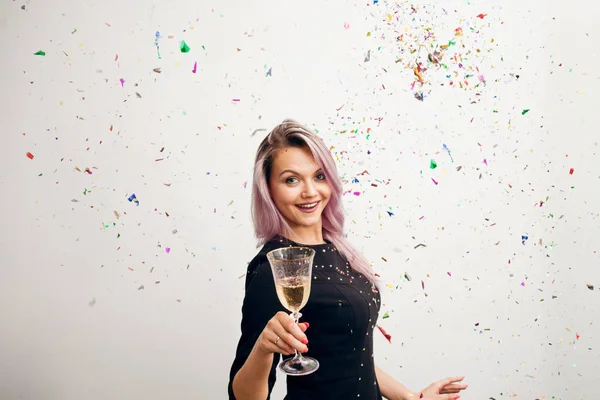 Funny young woman in black dress celebrating — Stock Photo, Image