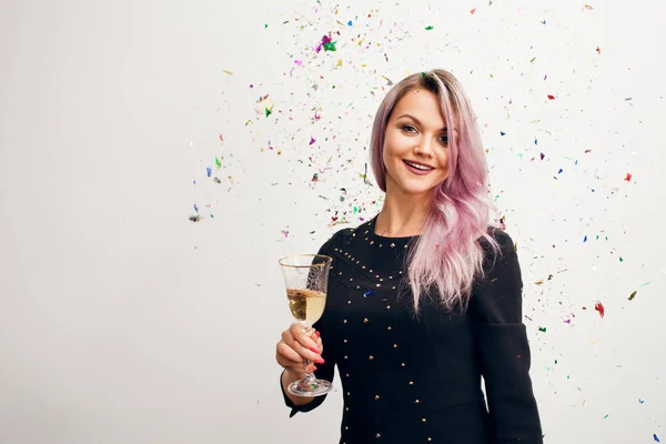 Funny young woman in black dress celebrating — Stock Photo, Image