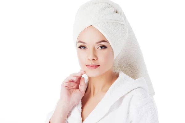 Beauty treatments after the bath. Portrait of a young beautiful woman in a Terry robe and with a towel on her head. — Stock Photo, Image