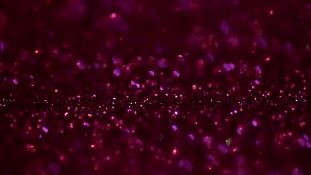 Scharlachrot glitzern magischen Hintergrund. defokussiertes Licht und freier fokussierter Platz für Ihr Design. — Stockvideo