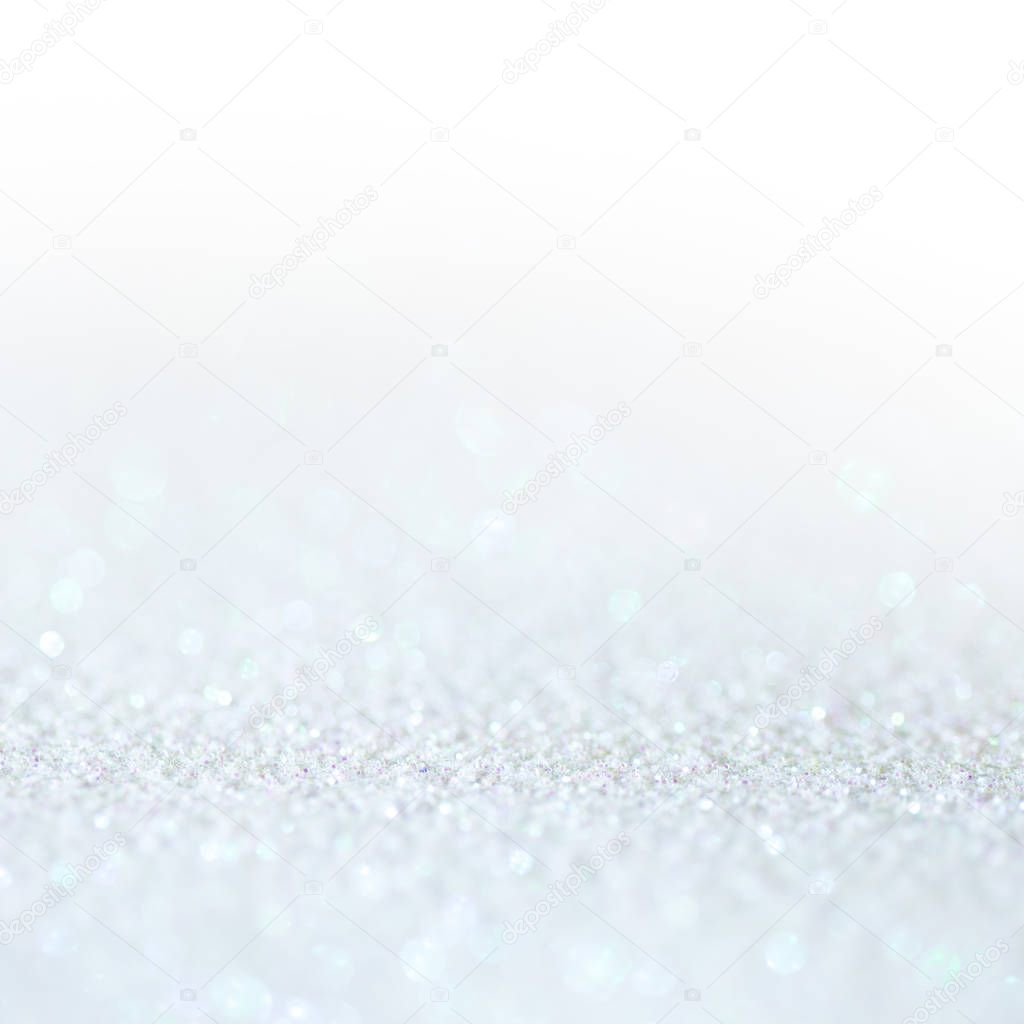 White light glitter magic background. Defocused light and free focused place for your design.