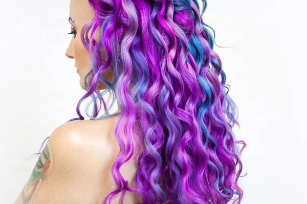 Delightfully bright colored hair, multi-colored coloring on long hair. The stylish, contemporary styling of curls. — Stock Photo, Image
