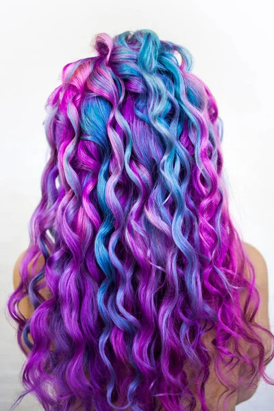 Beach curls on long colored hair. Bright color coloring, fashion and style. — Stock Photo, Image