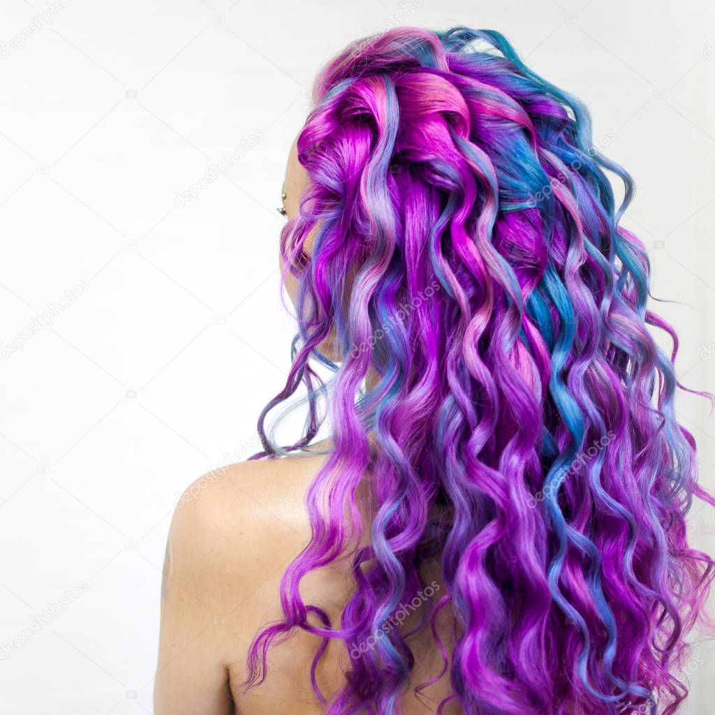 Delightfully bright colored hair, multi-colored coloring on long hair. The stylish, contemporary styling of curls.