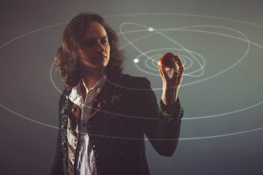 Fizik doğa bilimi, doğanın kanunlarını inceleme kavramı. Isaac Newton'un görüntüsünde genç bir adam.