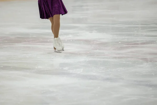 Figure skating, ice skating training. Feet skater on the ice