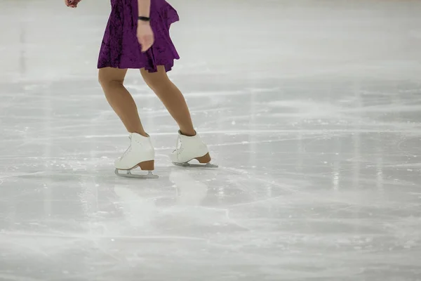 Figure skating, ice skating training. Feet skater on the ice