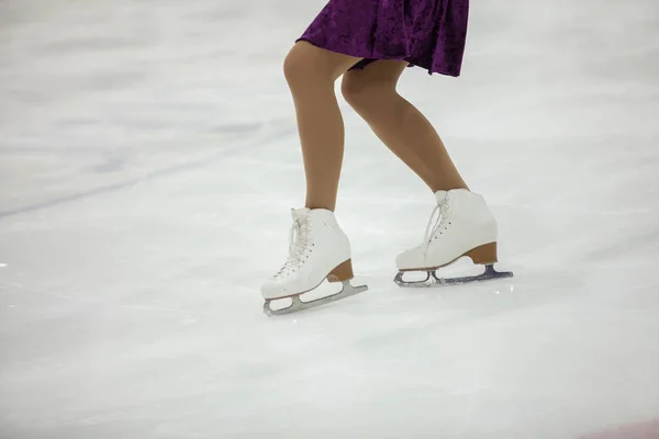 Figure skating, ice skating training. Feet skater on the ice