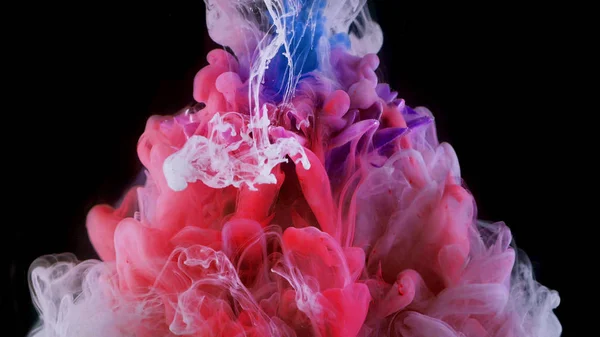 Spatten gekleurde inkt in water, heldere kleuren — Stockfoto