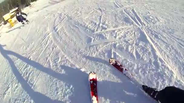 Descent from the snow slope on skis, first-person view. — Stock Video