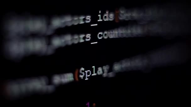 Code symbols on the computer screen, blur, dynamic focus. Programming language — Stock Video
