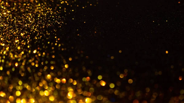 Abstract holiday background, gold Stardust on black. — Stock Photo, Image