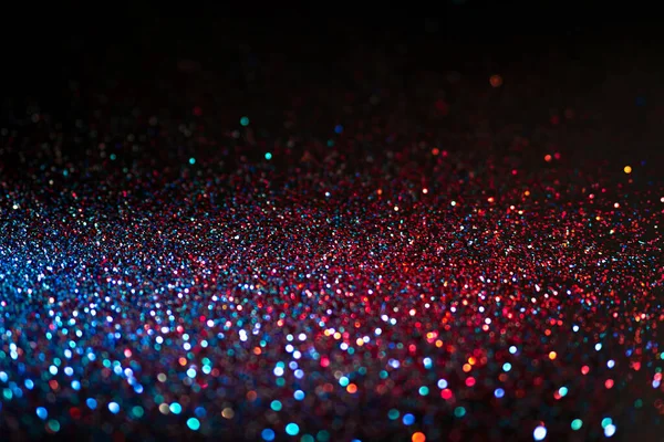 Multicolored shining glitter in focus and out of focus, abstract shiny background — Stock Photo, Image