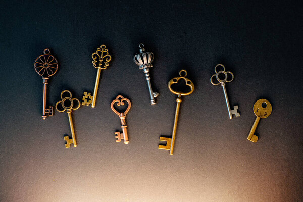 Many different old keys from different locks, scattered chaotically,