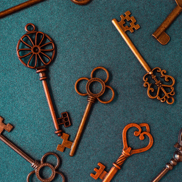 Many different old keys from different locks, scattered chaotically,