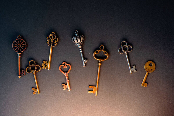 Many different old keys from different locks, scattered chaotically,