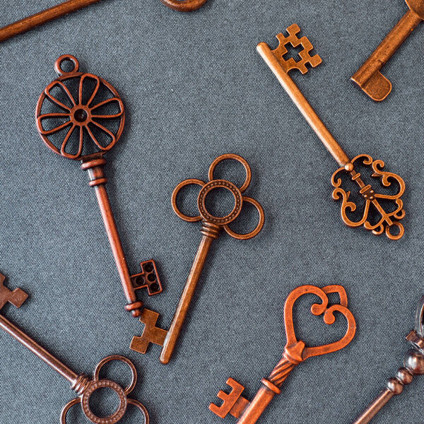 Many different old keys from different locks, scattered chaotically,