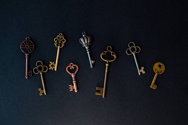 Many different old keys from different locks, scattered chaotically,