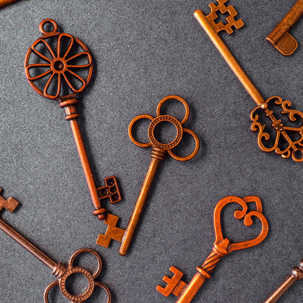 Many different old keys from different locks, scattered chaotically,