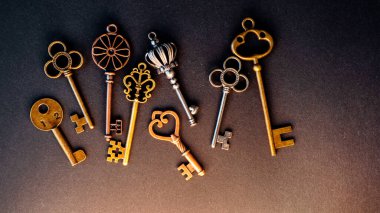 Many different old keys from different locks, scattered chaotically, clipart