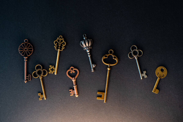 Many different old keys from different locks, scattered chaotically,