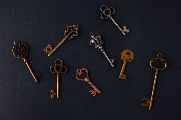 Many different old keys from different locks, scattered chaotically,