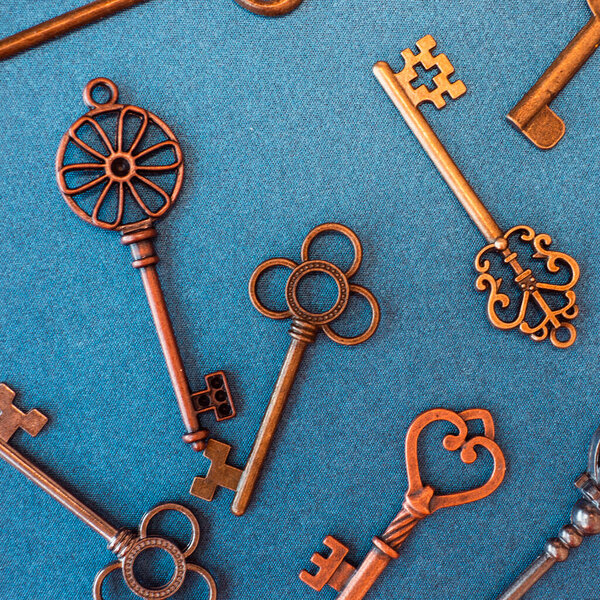 Many different old keys from different locks, scattered chaotically,