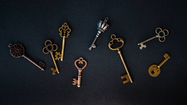 Many different old keys from different locks, scattered chaotically,