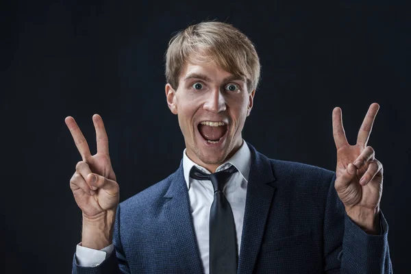 Happy businessman shows a two-thumbs-up gesture. In business, — Stock Photo, Image