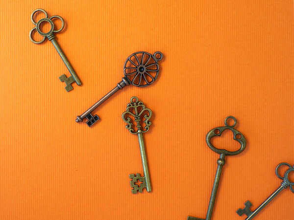 Many different old keys from different locks, scattered chaotically,
