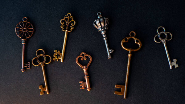 Many different old keys from different locks, scattered chaotically,