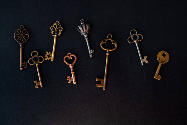 Many different old keys from different locks, scattered chaotically,
