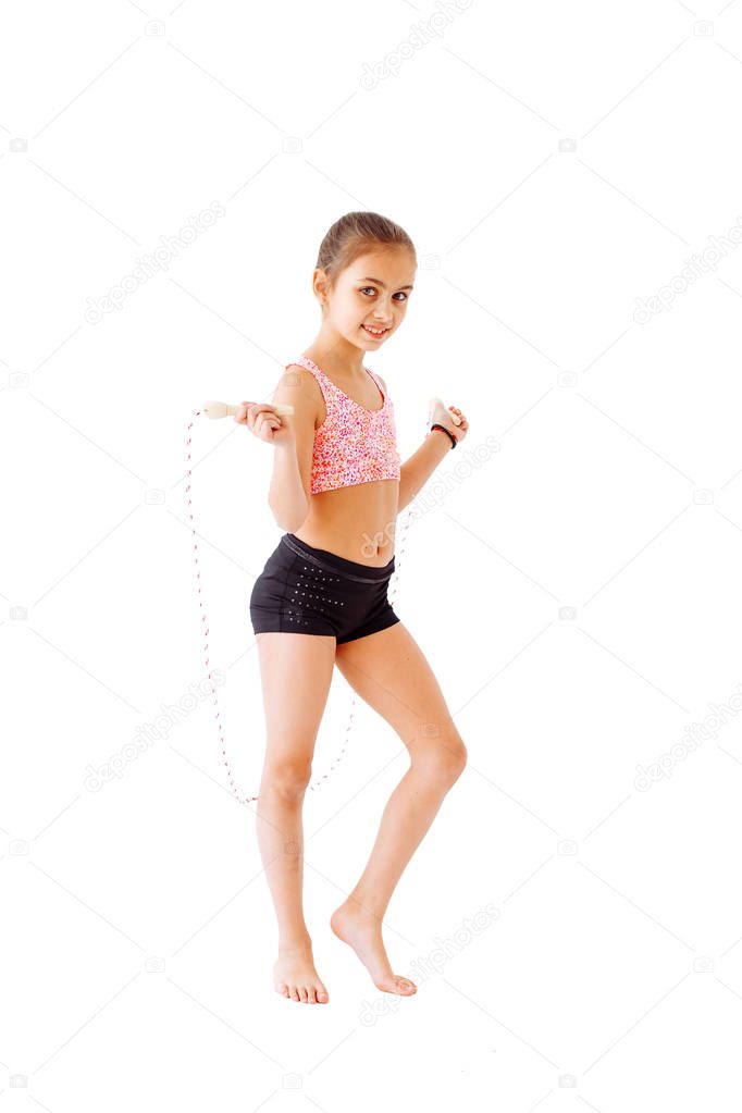 Little gymnast with a rope on a white background