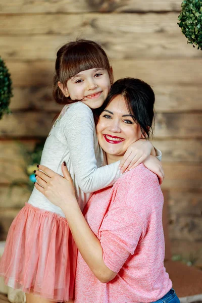 Daughter gently hugs mom — Stock Photo, Image