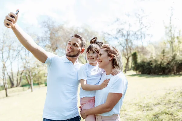 Family with child takes a selfie photo. — Stock Photo, Image