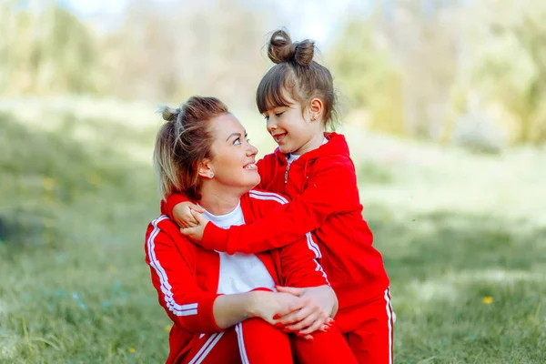Happy mother and daughter with embracing, close up portrait. — Stock Photo, Image